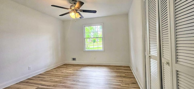 1306 Dominica Dr, Augusta, GA 30909 - unfurnished bedroom featuring wood finished floors, a closet, baseboards, and a ceiling fan