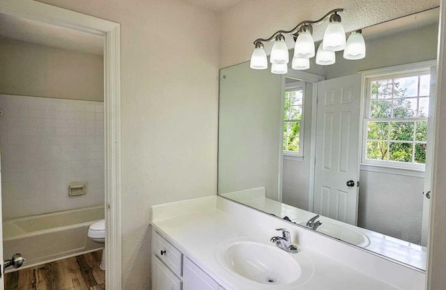 1306 Dominica Dr, Augusta, GA 30909 - full bathroom with wood finished floors, toilet, vanity, and a chandelier