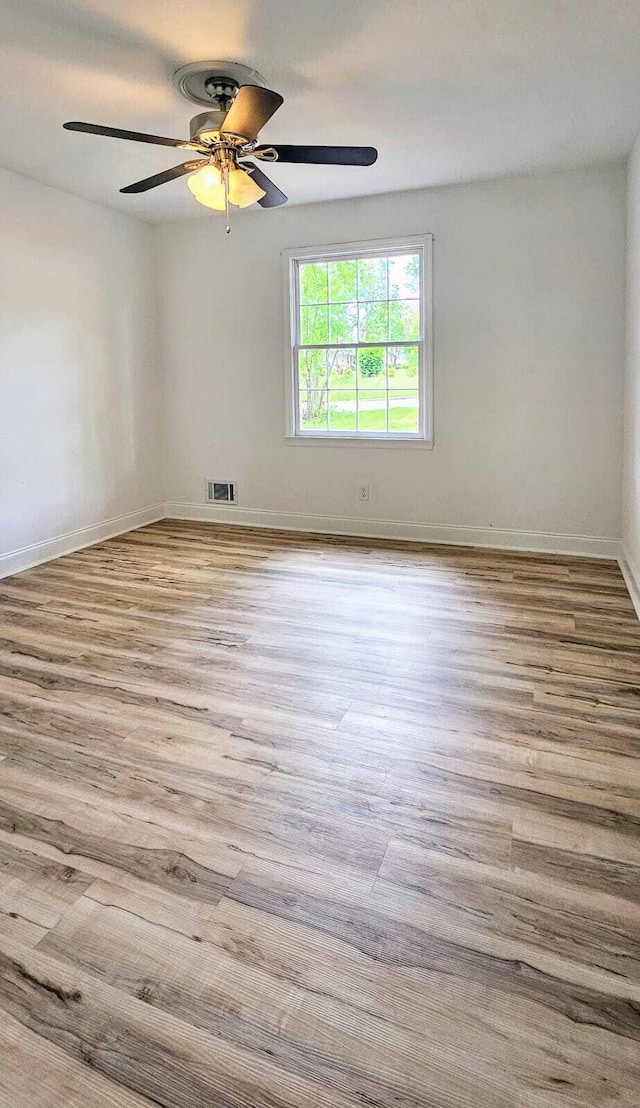 1306 Dominica Dr, Augusta, GA 30909 - empty room featuring wood finished floors, a ceiling fan, and baseboards