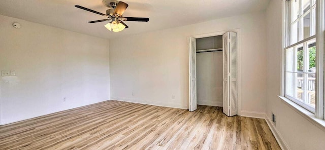 1306 Dominica Dr, Augusta, GA 30909 - unfurnished bedroom featuring wood finished floors, a closet, baseboards, and a ceiling fan