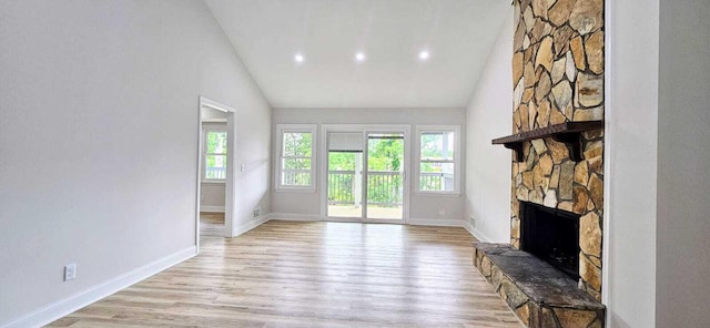 1306 Dominica Dr, Augusta, GA 30909 - unfurnished living room featuring a fireplace, light wood-type flooring, baseboards, recessed lighting, and high vaulted ceiling