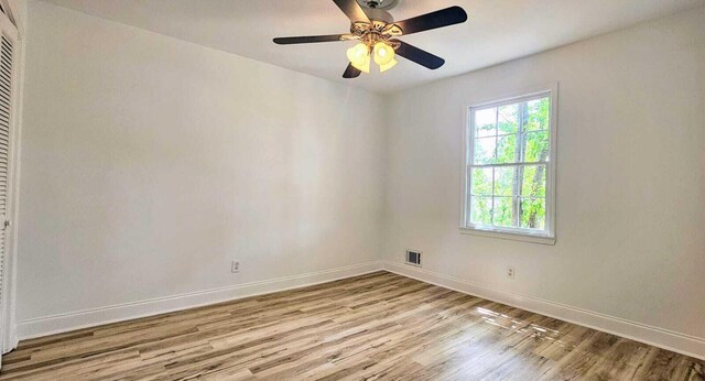 1306 Dominica Dr, Augusta, GA 30909 - spare room with wood finished floors, baseboards, and a ceiling fan