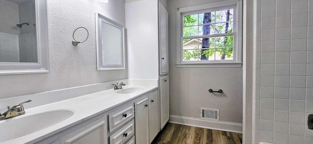 1306 Dominica Dr, Augusta, GA 30909 - full bath with healthy amount of natural light, wood finished floors, double vanity, and baseboards