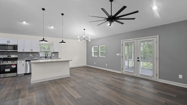 4593 Windsor Spring Rd, Hephzibah, GA 30815 - kitchen with stainless steel appliances, healthy amount of natural light, white cabinets, and high vaulted ceiling