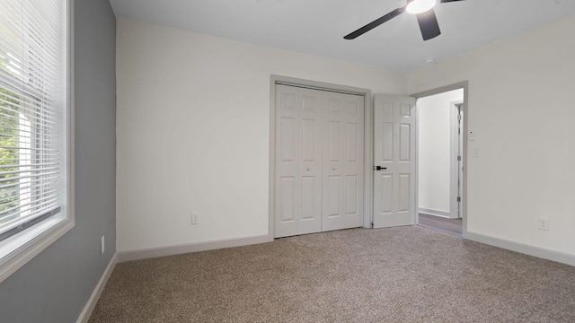 4593 Windsor Spring Rd, Hephzibah, GA 30815 - unfurnished bedroom with carpet, a closet, and a ceiling fan
