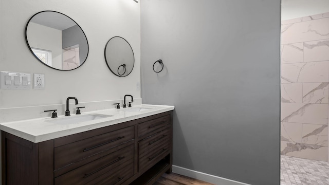 4593 Windsor Spring Rd, Hephzibah, GA 30815 - full bath with double vanity and wood finished floors