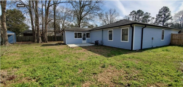 back of property with a lawn, a patio area, and central air condition unit