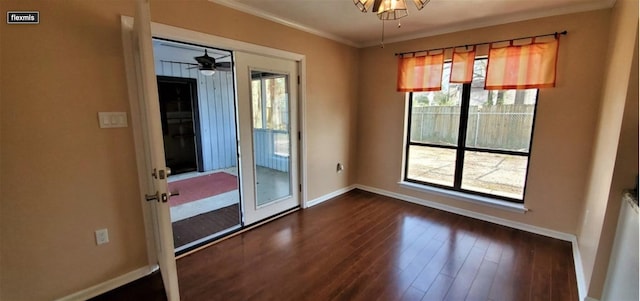 unfurnished dining area with ceiling fan, crown molding, dark wood-type flooring, and french doors