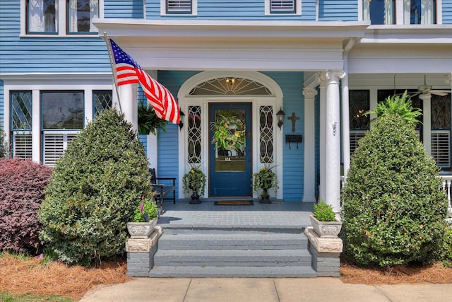 view of exterior entry featuring a porch