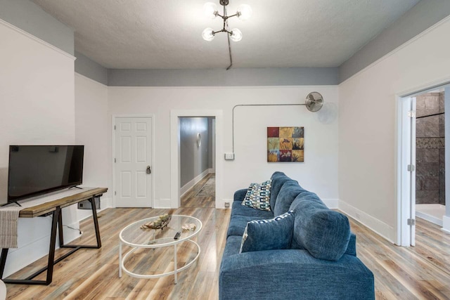 living room with hardwood / wood-style flooring and a textured ceiling