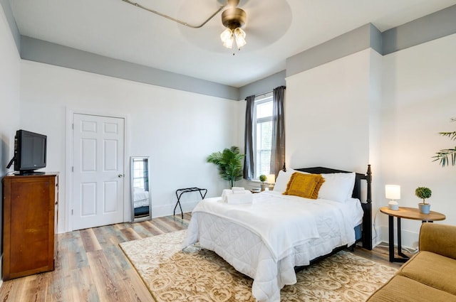 bedroom featuring ceiling fan and light wood-type flooring