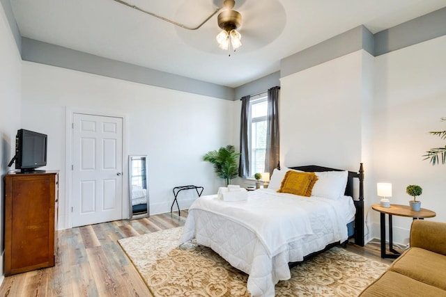 bedroom featuring ceiling fan and light wood-type flooring