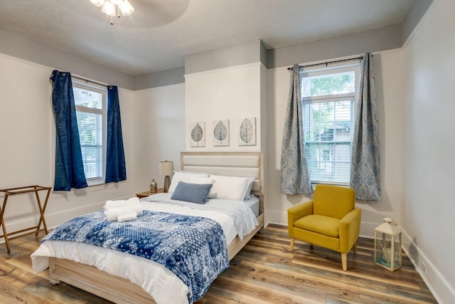 bedroom with hardwood / wood-style floors