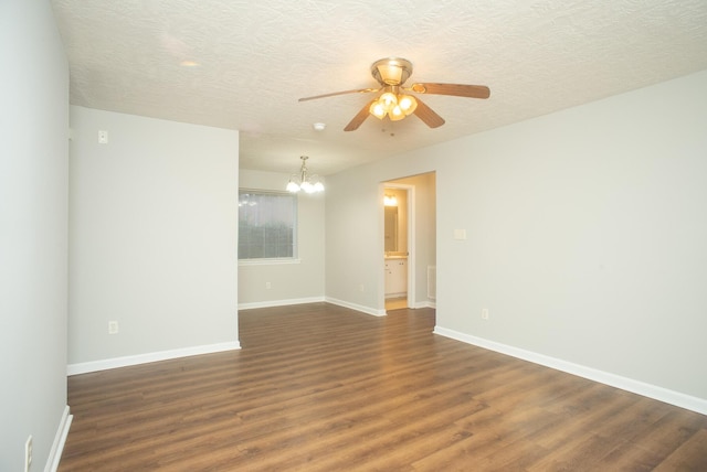 unfurnished room with a textured ceiling, ceiling fan with notable chandelier, and dark wood-type flooring