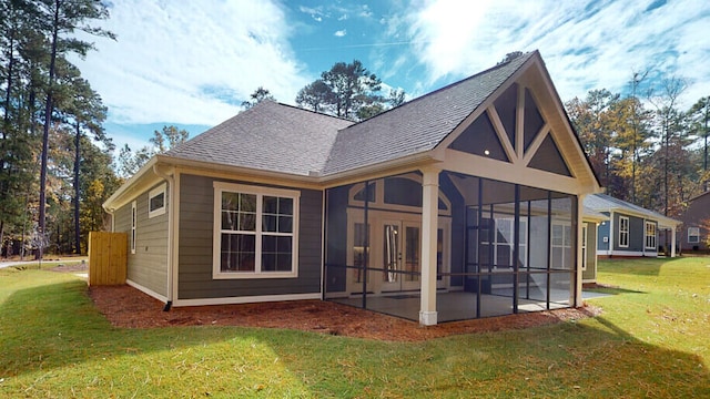 151 Cypress Dr, Mccormick, SC 29835 - rear view of house with a sunroom, a patio area, and a lawn