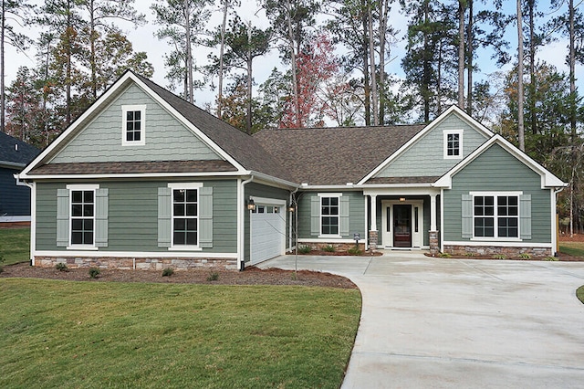 craftsman-style home featuring a garage and a front yard