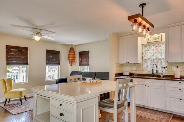 2010 Battle, Augusta, GA 30904 - kitchen with a center island, decorative backsplash, a kitchen bar, and a ceiling fan