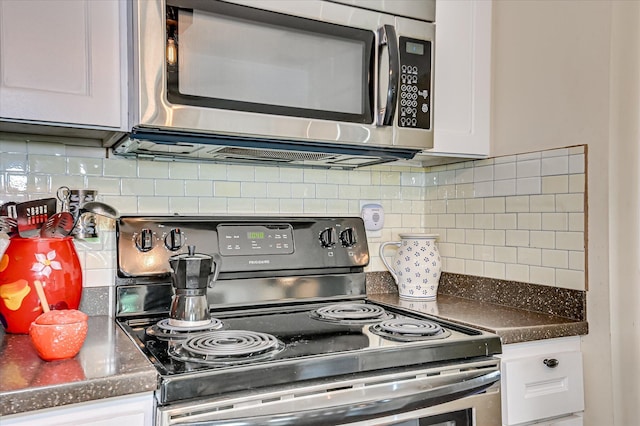 2010 Battle, Augusta, GA 30904 - kitchen with stainless steel microwave, black electric range oven, white cabinetry, and dark countertops