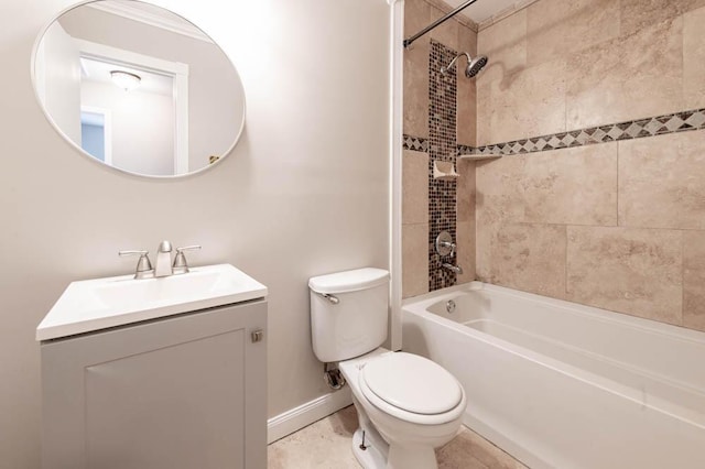 full bathroom featuring vanity, toilet, and tiled shower / bath