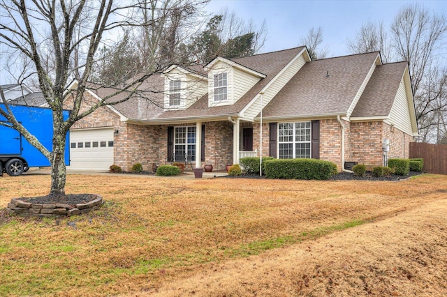 cape cod-style house with a garage and a front lawn