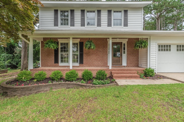 1 Partridge Ct, Aiken, SC 29803 - traditional home featuring covered porch, brick siding, a garage, and a front lawn