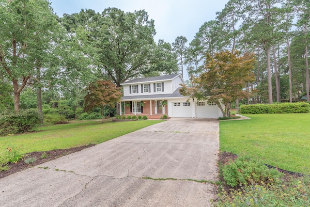 1 Partridge Ct, Aiken, SC 29803 - traditional-style home featuring covered porch, concrete driveway, a garage, and a front lawn