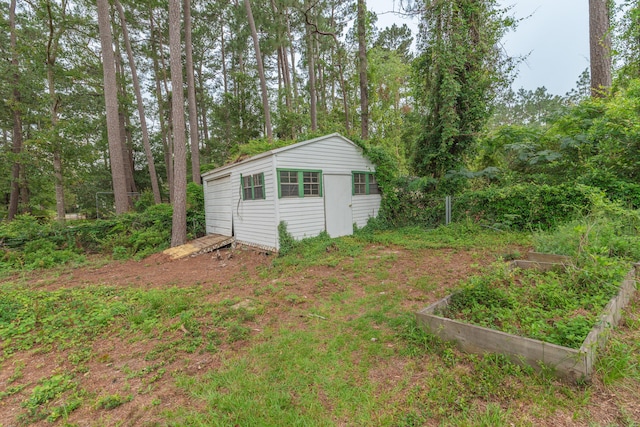 1 Partridge Ct, Aiken, SC 29803 - view of yard featuring a vegetable garden and an outbuilding