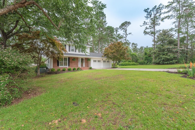 1 Partridge Ct, Aiken, SC 29803 - traditional-style house featuring a garage, driveway, a porch, a front lawn, and brick siding