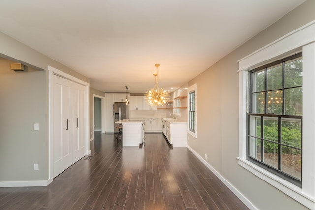 1 Partridge Ct, Aiken, SC 29803 - unfurnished dining area with a chandelier and dark wood-style floors