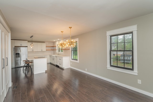 1 Partridge Ct, Aiken, SC 29803 - unfurnished living room featuring a chandelier and dark wood finished floors