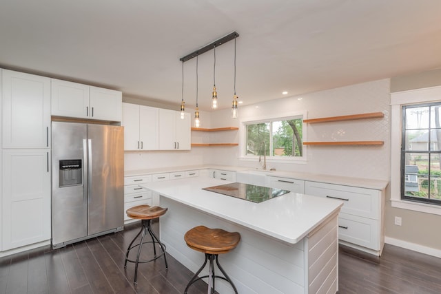 1 Partridge Ct, Aiken, SC 29803 - kitchen featuring stainless steel fridge, open shelves, black electric stovetop, dark wood-type flooring, and a breakfast bar
