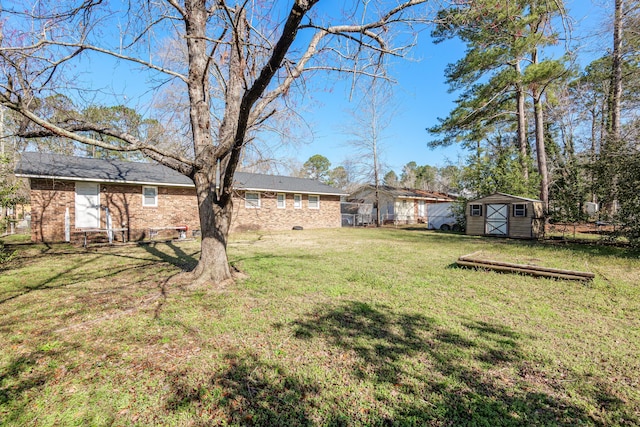 view of yard with an outbuilding and a shed