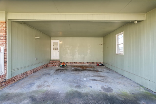 view of patio with entry steps and a carport