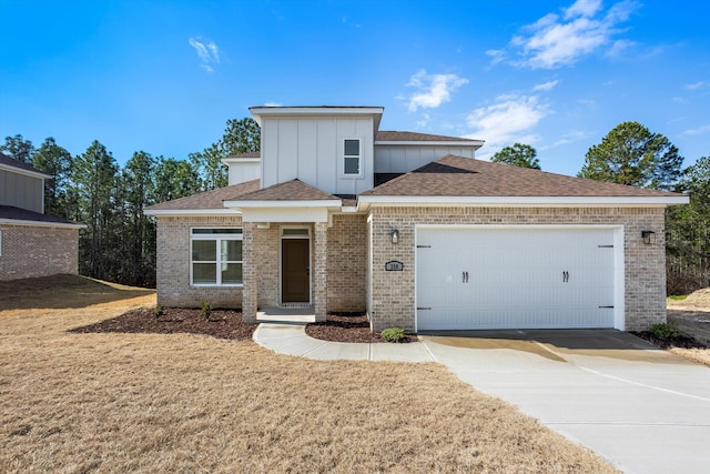 view of front of home with a garage and a front yard