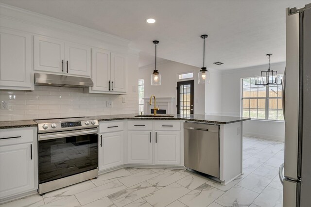 kitchen with stainless steel appliances, a sink, under cabinet range hood, light marble finish floors, and recessed lighting