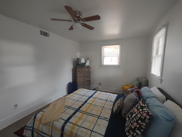 bedroom featuring hardwood / wood-style floors and ceiling fan