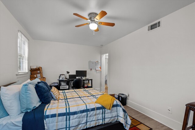 bedroom featuring hardwood / wood-style floors and ceiling fan