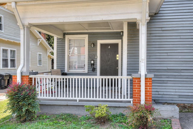 doorway to property featuring covered porch