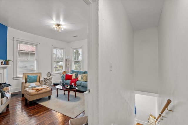 sitting room featuring dark hardwood / wood-style flooring