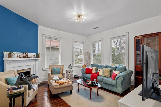 living room featuring dark wood-type flooring