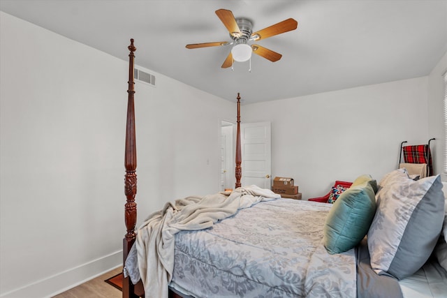 bedroom featuring light hardwood / wood-style floors and ceiling fan