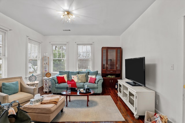 living room featuring dark wood-type flooring