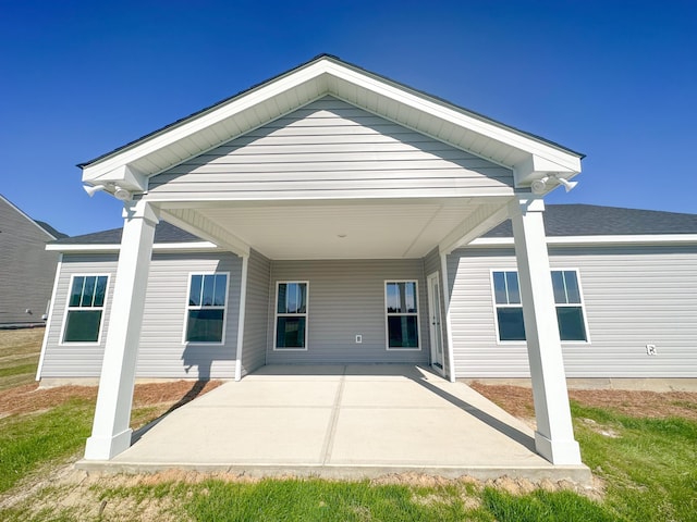 back of property featuring a patio area