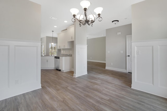 interior space featuring a chandelier and light hardwood / wood-style flooring