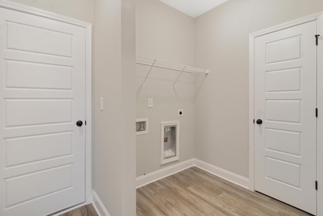 laundry area featuring electric dryer hookup, washer hookup, and light hardwood / wood-style floors