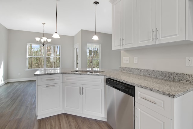 kitchen with decorative light fixtures, white cabinetry, dishwasher, sink, and dark wood-type flooring