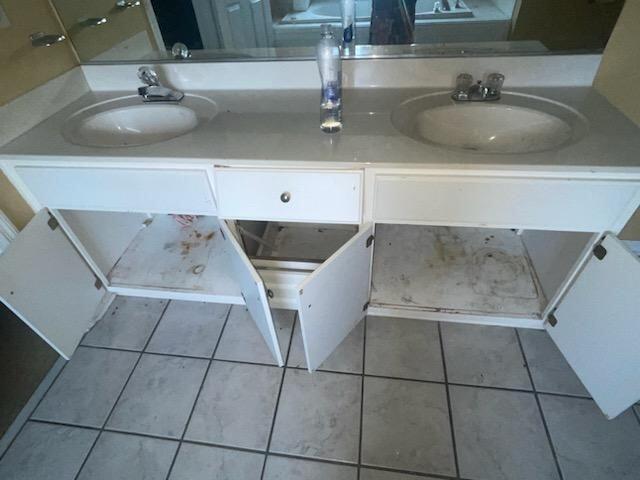 bathroom with tile patterned flooring and vanity