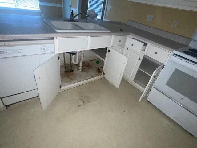 kitchen featuring white cabinets, dishwasher, range, and sink