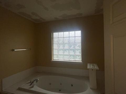 bathroom with a tub