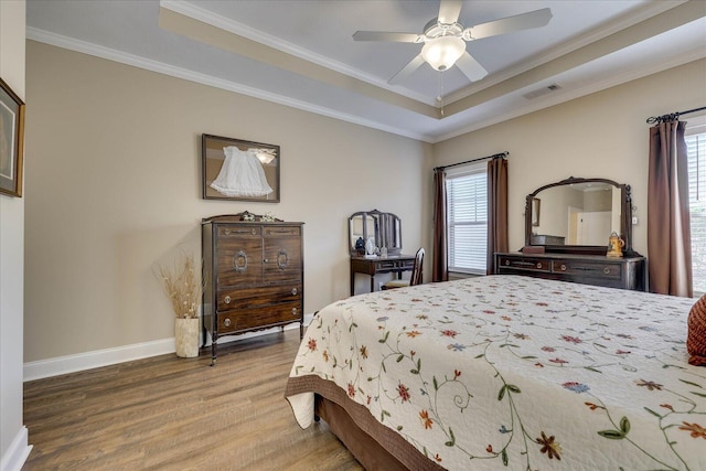 186 Tara Dr, Mccormick, SC 29835 - bedroom featuring a raised ceiling, multiple windows, visible vents, and wood finished floors
